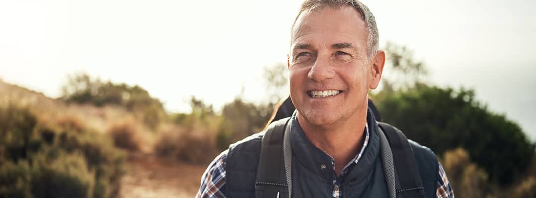 Older man hiking outside